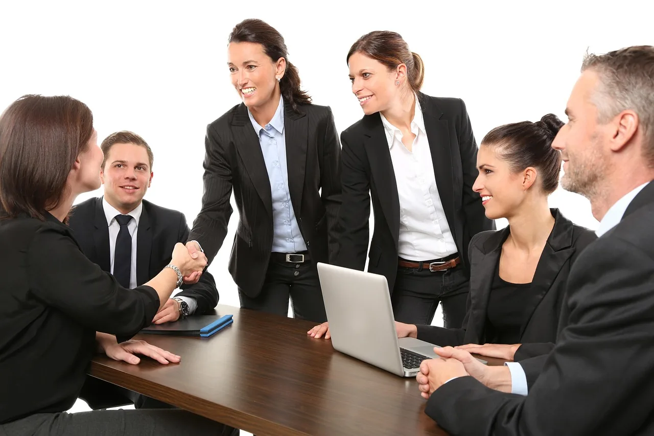 Professional services team meeting across a conference table